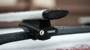 Roof rack end with ice on it