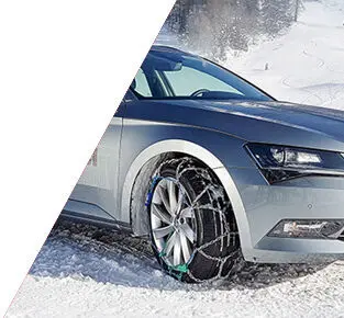 front side of a car with snow chains on
